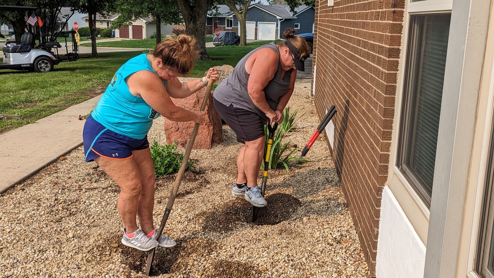 Tammy Cousins and Angie Herington planting flowers at Ekstrand